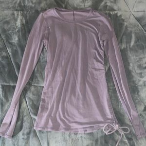 Lululemon long sleeve shirt size 2. There is a small hole in the sleeve.